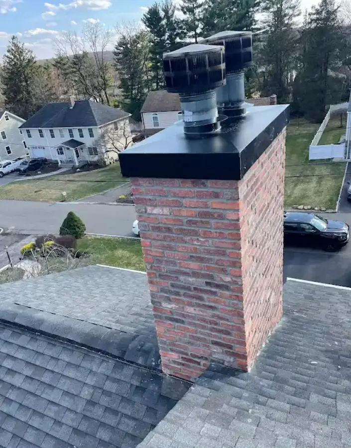 Custom concrete chimney crown and stainless flue cap installation in PA